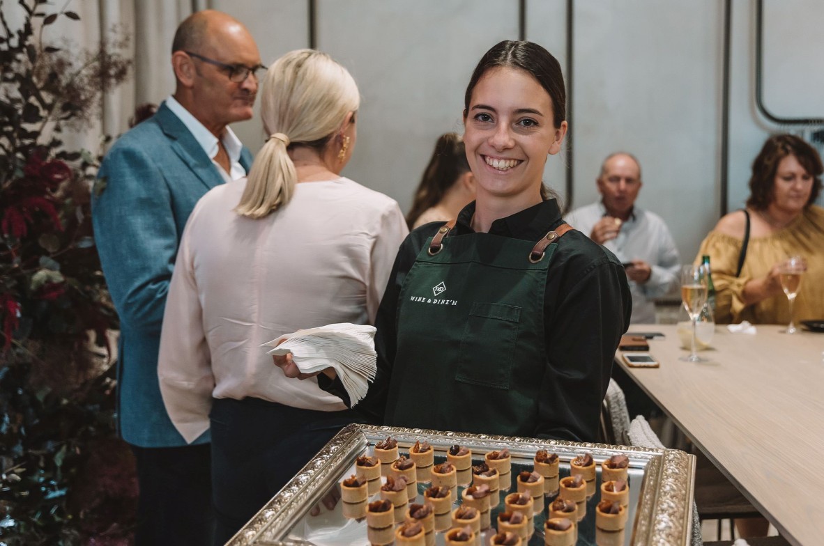 Caterer holding a try of finger food