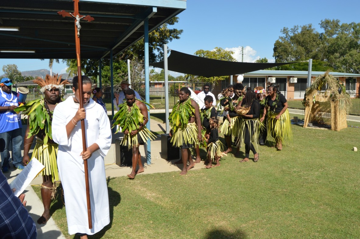 Young men and women dressed in traditional costumes in the procession for the Coming of the Light Festival on Erub Island, 1 July 2016