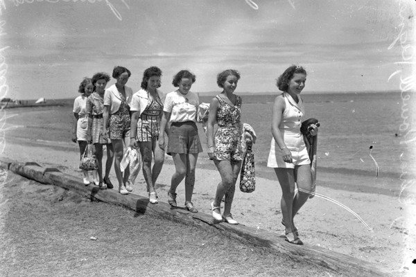 Young women taking a walk along the beach