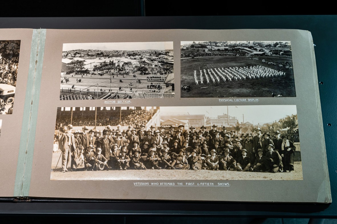 An album of black and white photos of Brisbane Jubilee exhibition scenes, including crowds and exhibits.