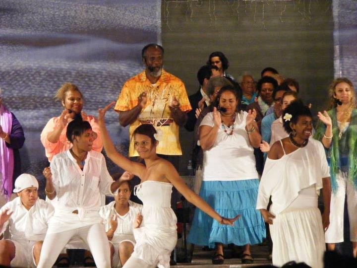 Group dancing scene from Behind the Cane musical production