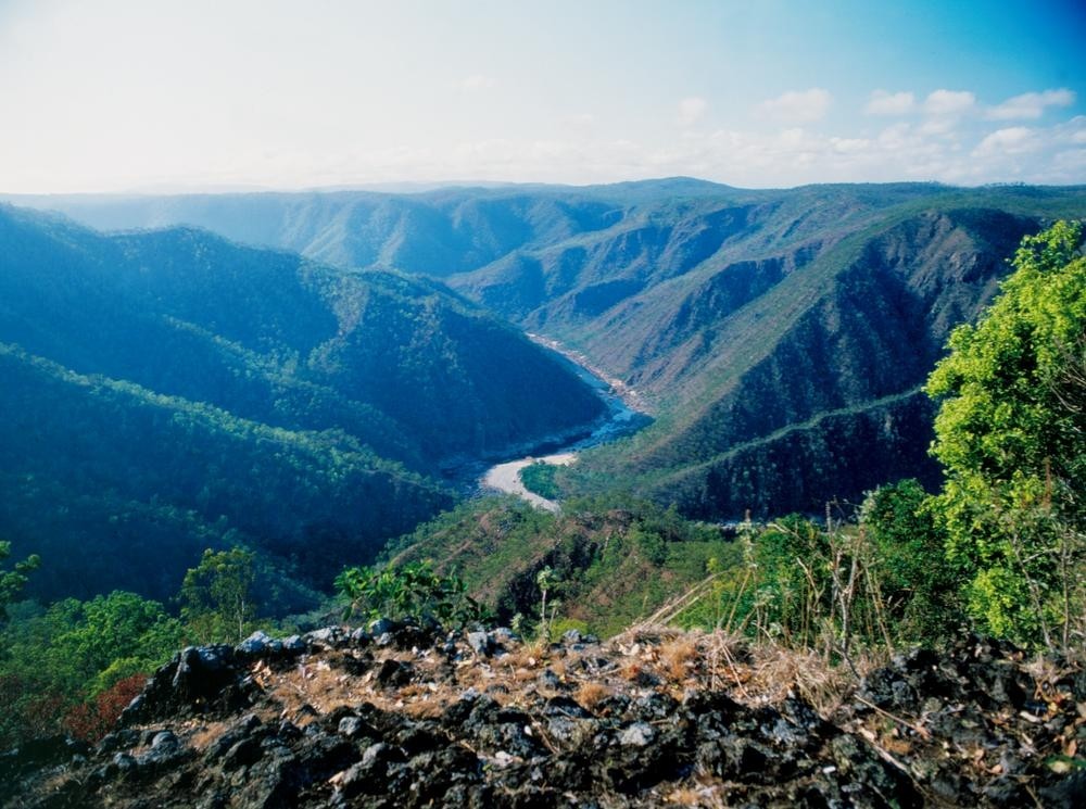 view of a river valley surrounded by large green mountains, Herbert valley