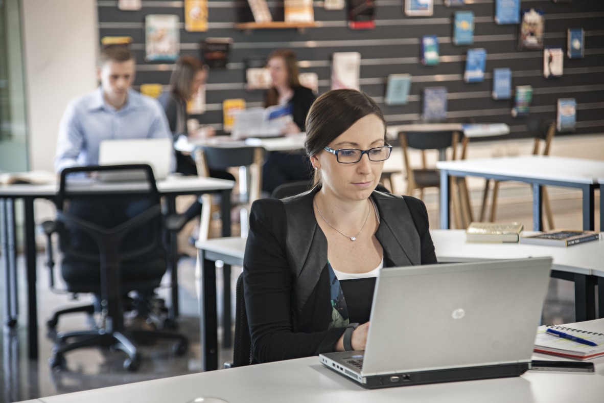 Woman using a laptop in the Business Studio