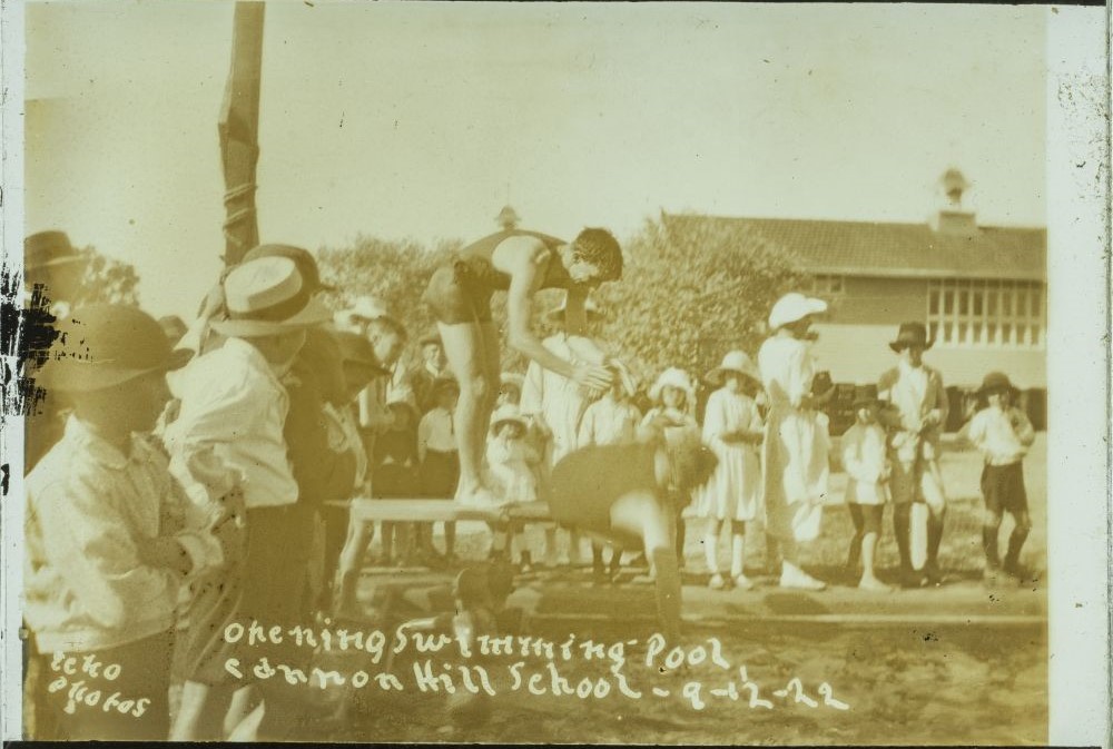 Young man diving into the Cannon Hill State School swimming pool at its opening, Brisbane, 1922