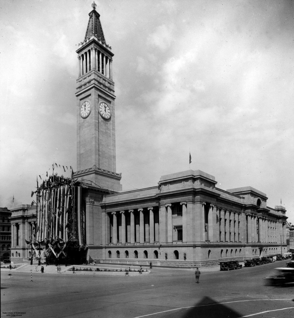 Official opening of Brisbane City Hall, 8 April 1930. The front of the hall is decorated with flags and banners. The photograph taken from the Ann Street side of hall.