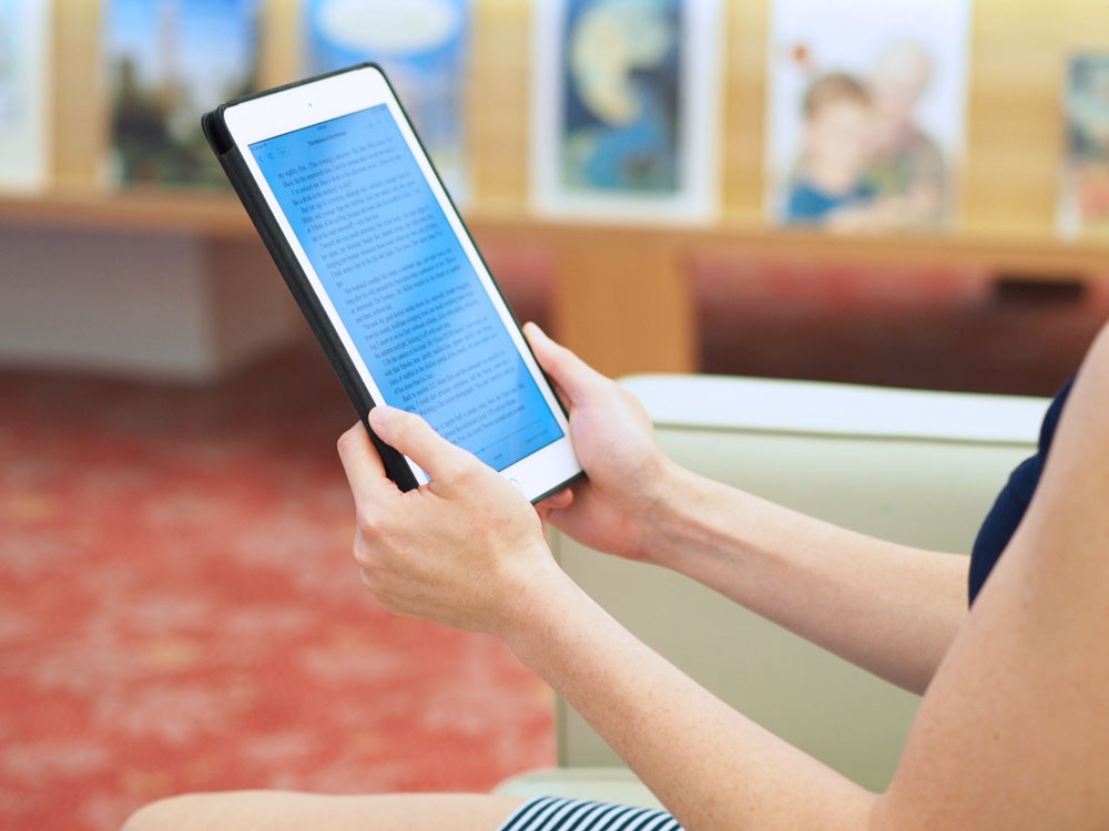 A person reading an eBook at the library