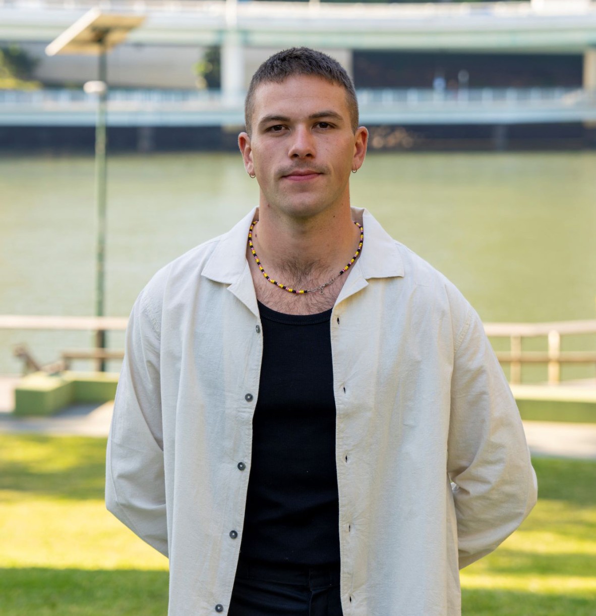 Dakota Feirer, 2023 black&write! Fellowship winner standing outside State Library of Queensland