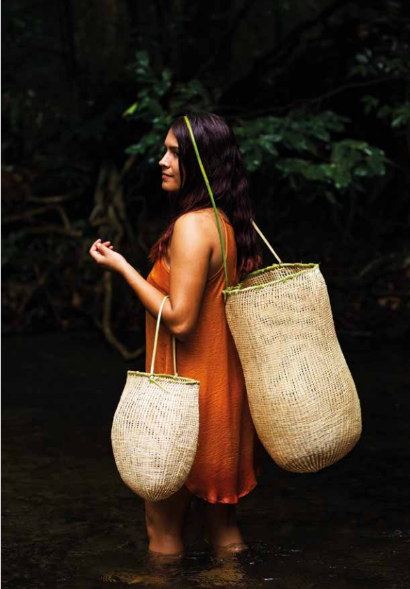 Artist Delissa Walker with Black palm dilly bags 