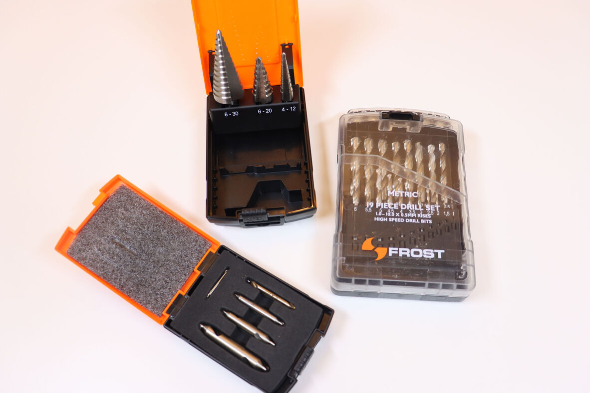 a photo of three different sets of drill bits.