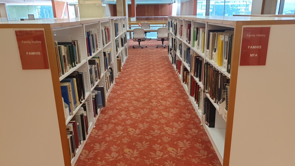 Book shelves containing some of State Library of Queensland's family history collection