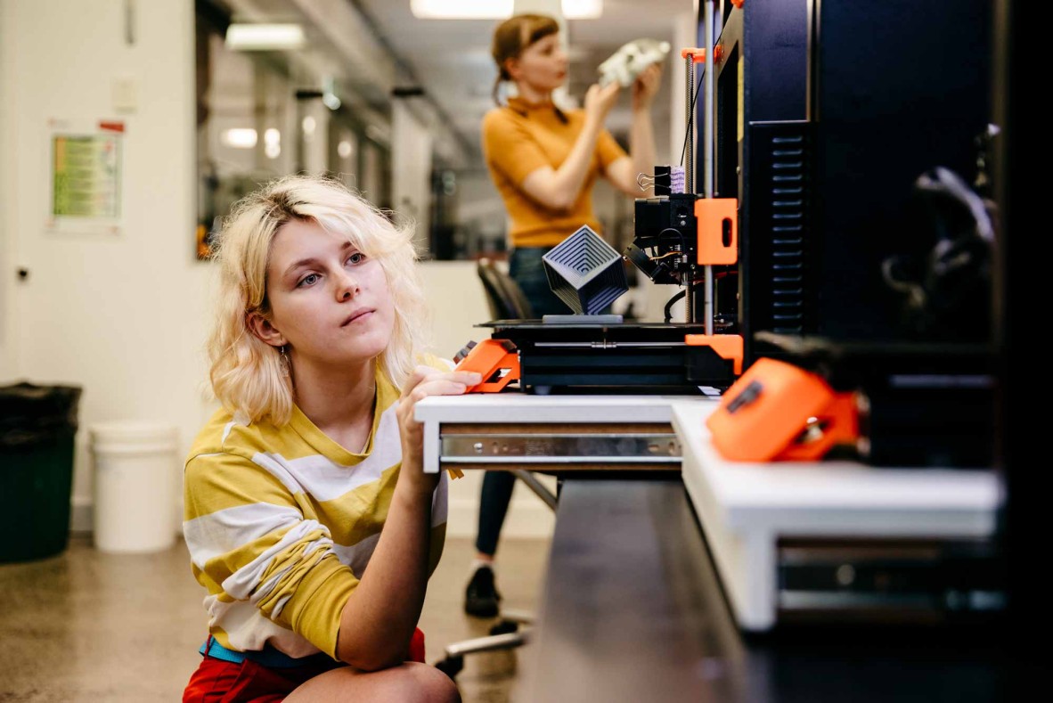 Woman using a 3D printer at The Edge.