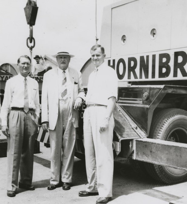 three men stand behind a truck on a Hornibrook construction site