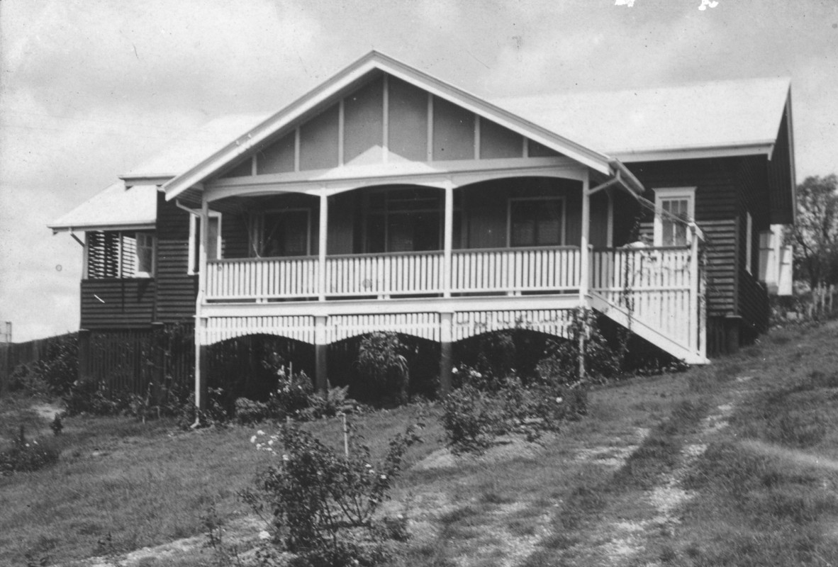 A house with gables on a sloping lawn