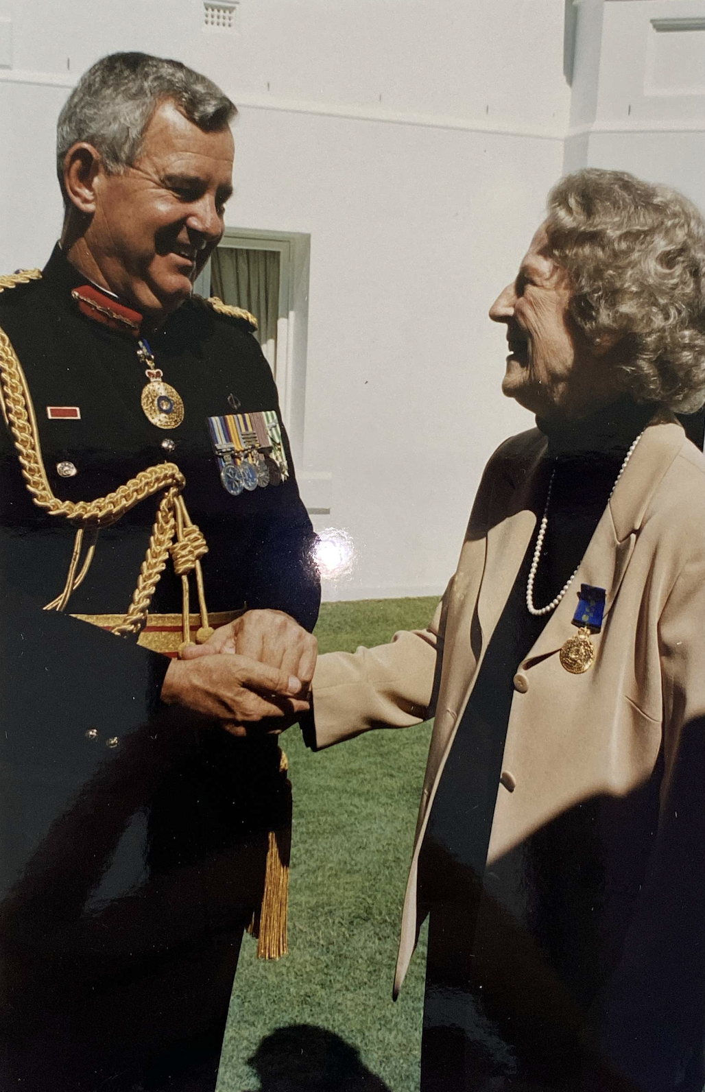 Christina Boughen with Major General the Honourable Peter Arnison AC CVO, 2002. 32654/40 Christina Boughen OAM and Robert Boughen OBE papers, John Oxley Library, State Library of Queensland.