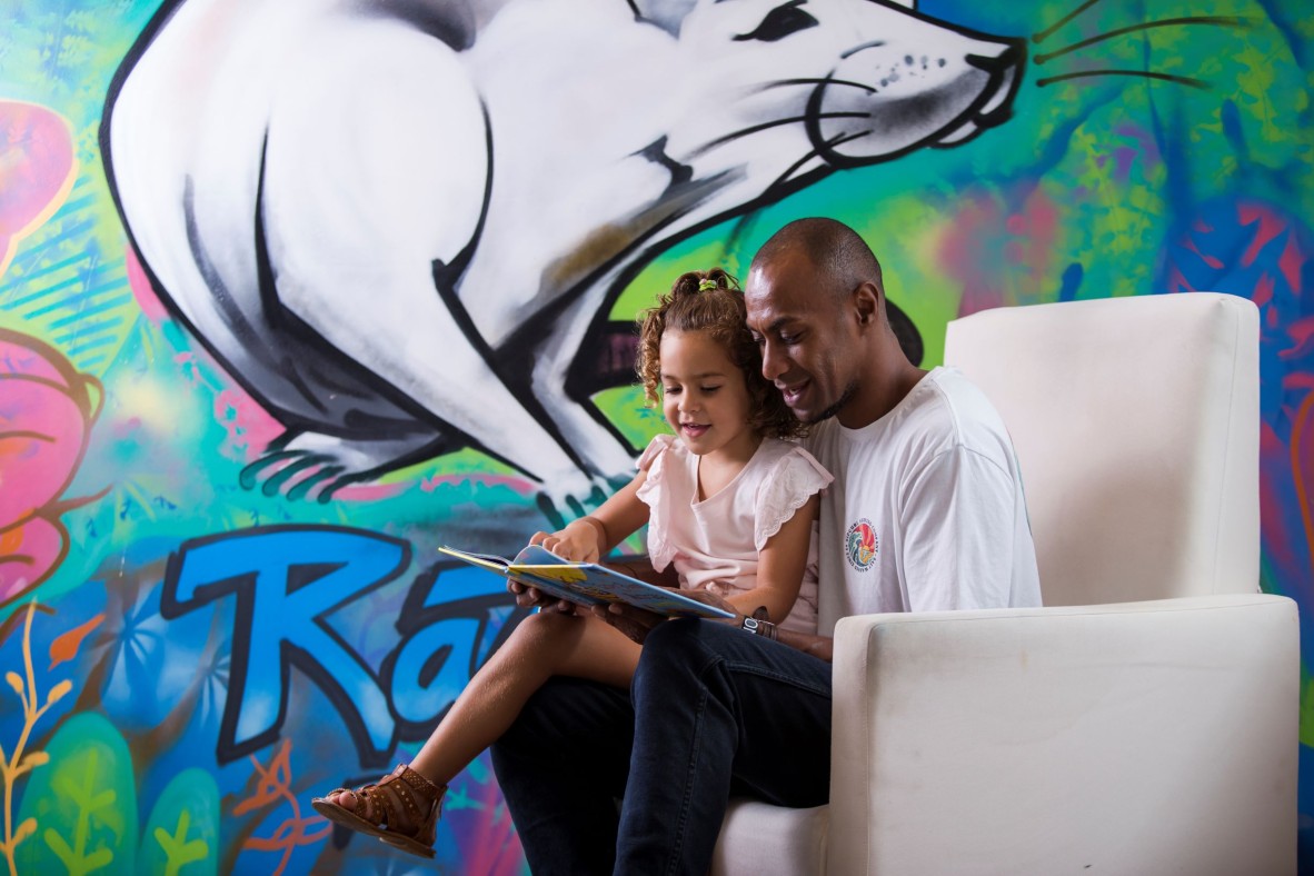 Father and daughter reading together
