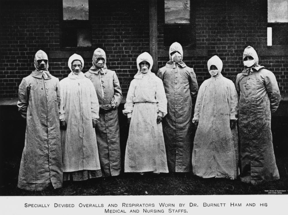 several figures dressed in protective clothing