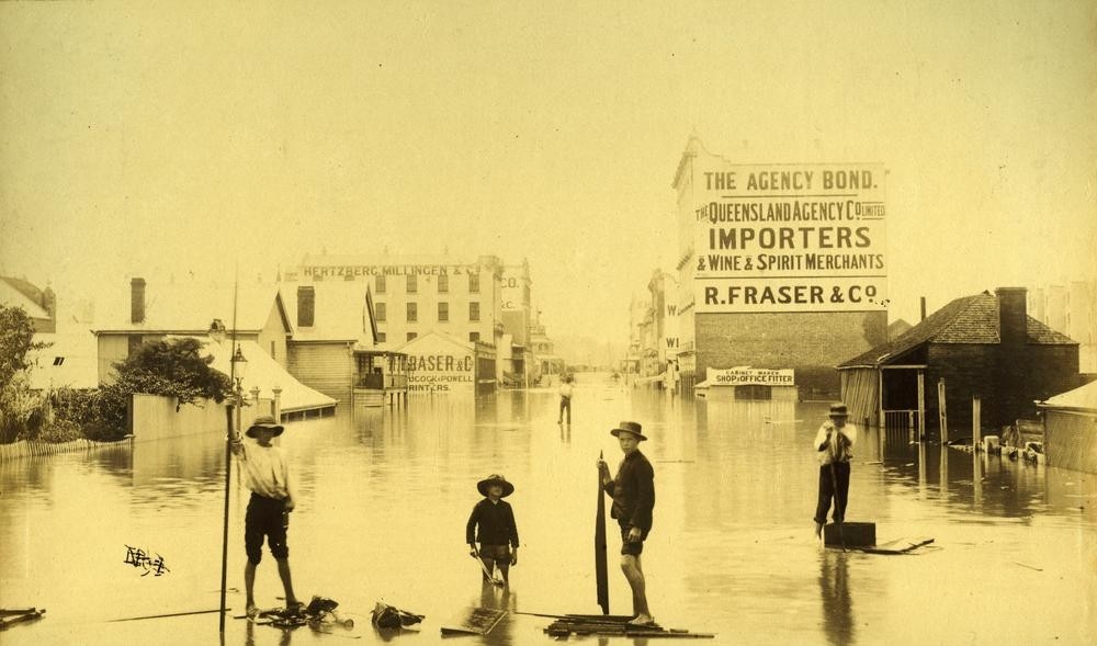 people stand in floodwaters in a flooded brisbane street, 1893