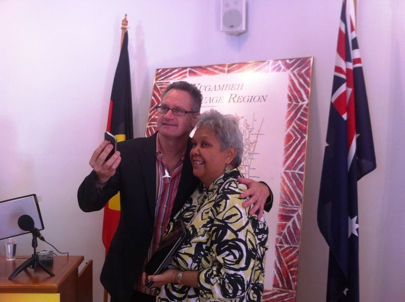 Rory OConnor and Jackie Huggins holding iPhone and iPad at the launch of Yugambeh Language App