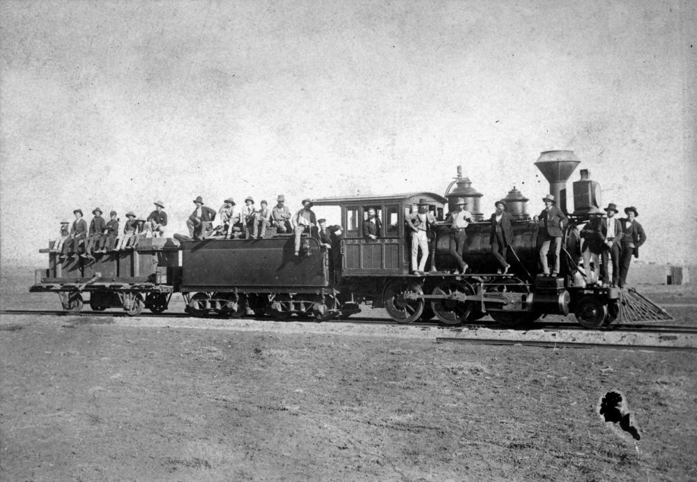 Locomotive named 'Pioneer' on the Western Railway construction site between Roma and Mitchell, ca. 1885.