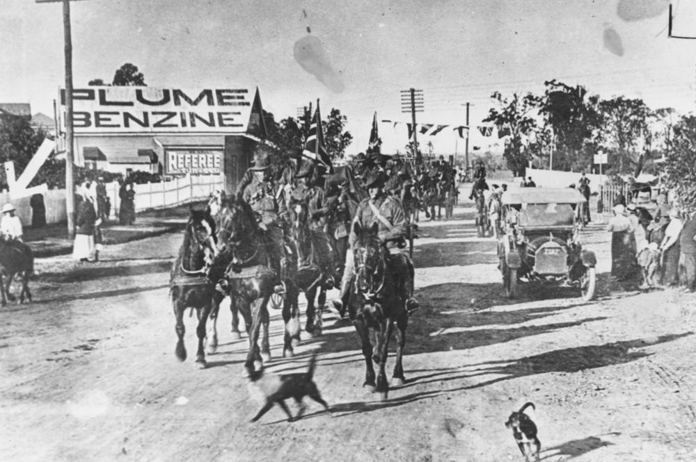 Dungarees passing along Ipswich Road Moorooka 1915 John Oxley Library State Library of Queensland Neg 11395