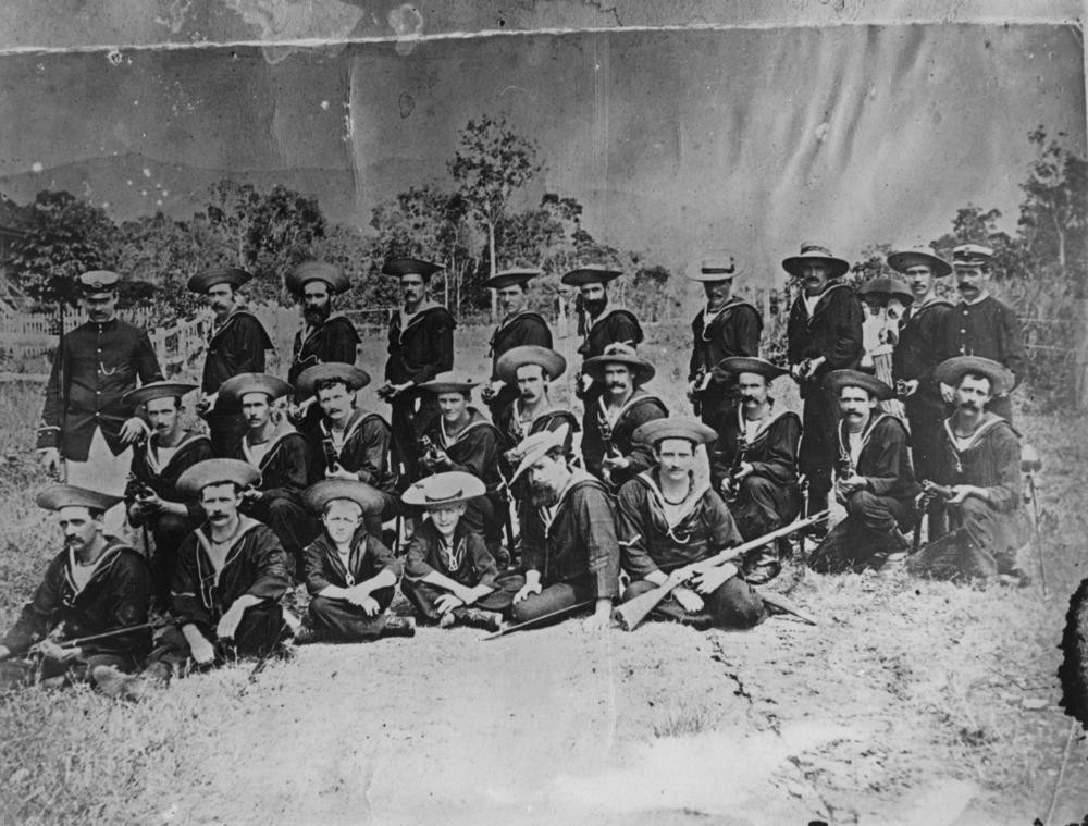 Group photograph of the Cairns Naval Brigade including some children in the front row, ca. 1890.