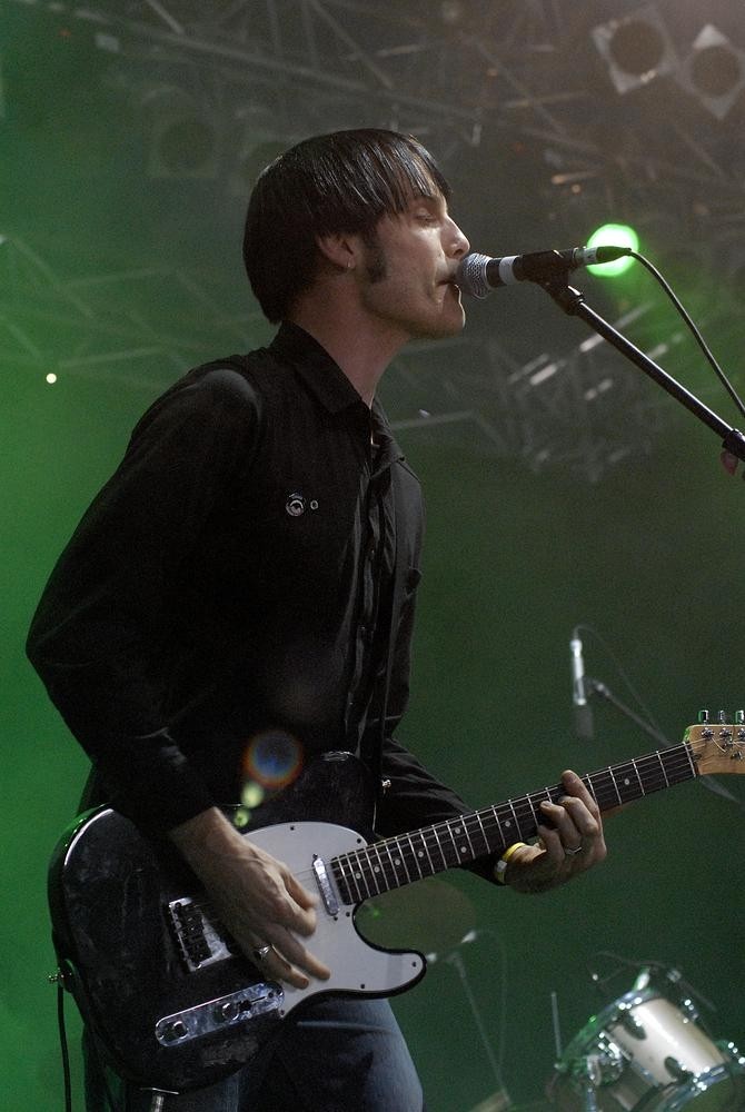 Tim Steward with Screamfeeder performing at the Pig City Concert, Brisbane, July 2007. John Oxley Library, State Library of Queensland. Image 7336-0001-0115