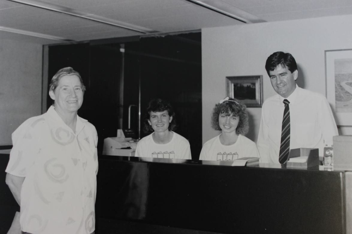 4 library staff pose for a photo 