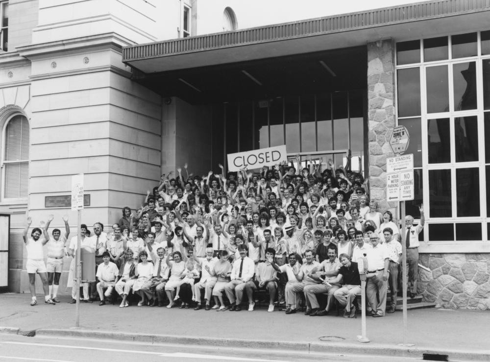 Library staff celebrate the closure of the old State Library building in William Street, Brisbane, 1988. John Oxley Library, State Library of Queensland. Neg 68154