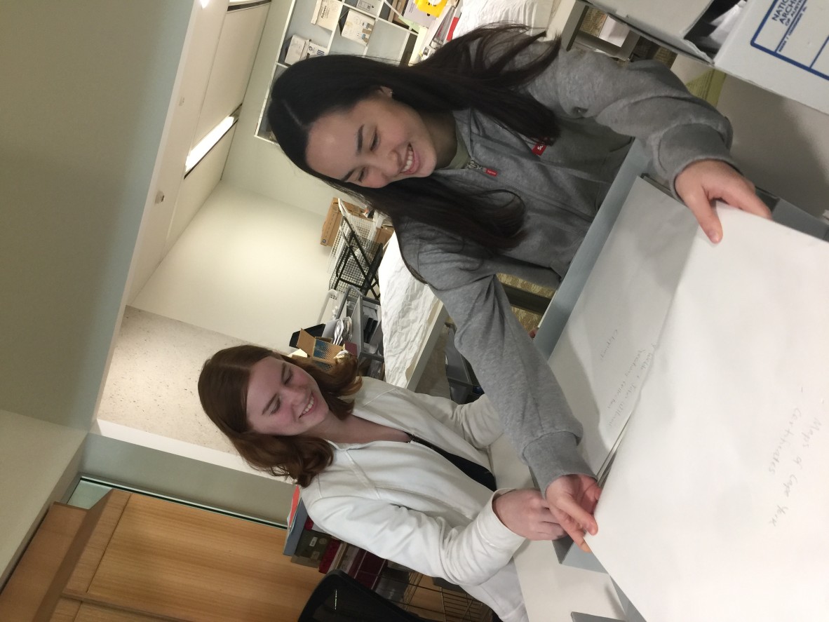 Grace Dowdle and Kelsey Frith search for treasures in State Library of Queensland original materials collections