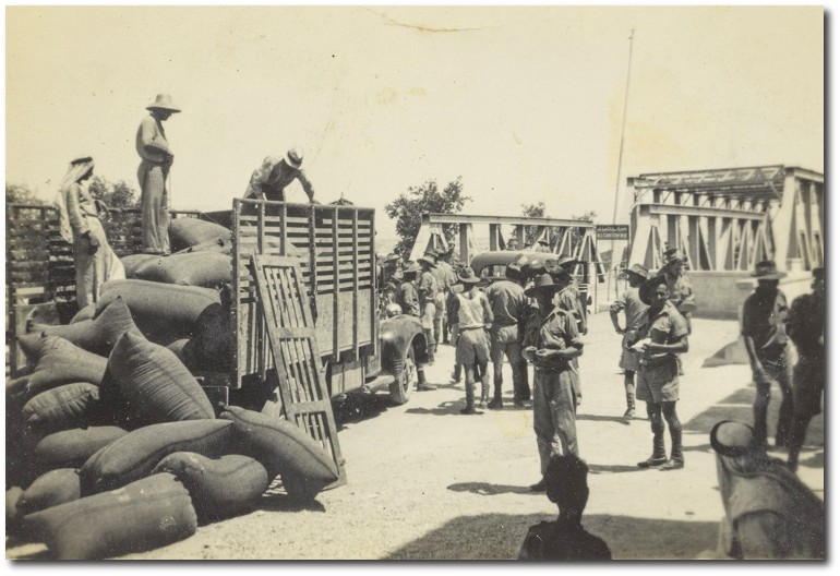 Loading trucks on the trans-Jordan Bridge, Palestine