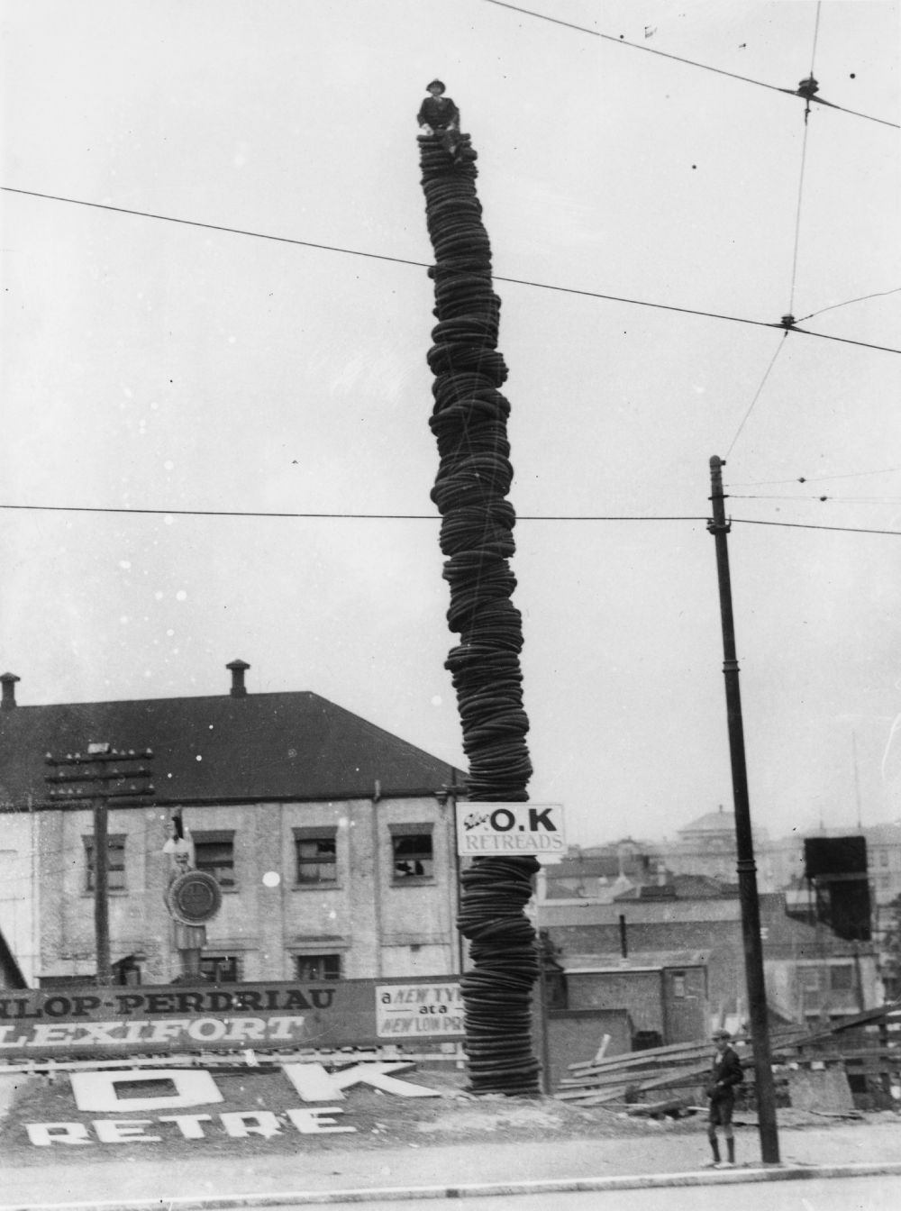 Tower of used tyres on Barry Parade, Fortitude Valley, Queensland, 1933