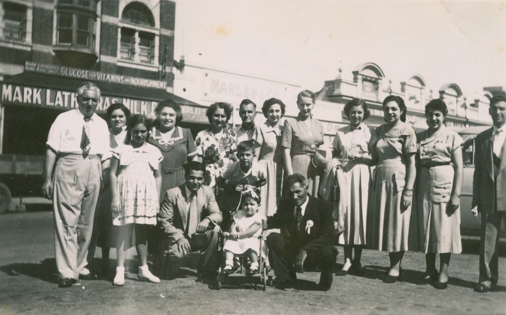 Group portrait with Mark Lathouras and others outside the Cafe Royal, Bundaberg.