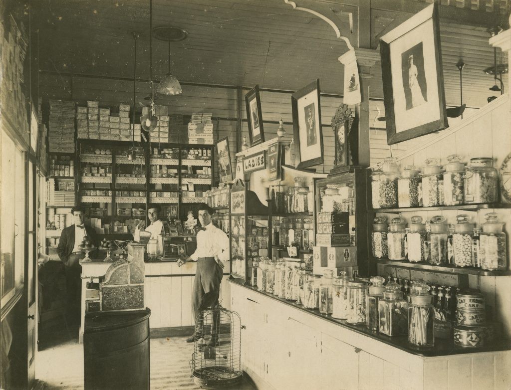 Interior of cafe and bar at Winton with 3 men standing to back of photo