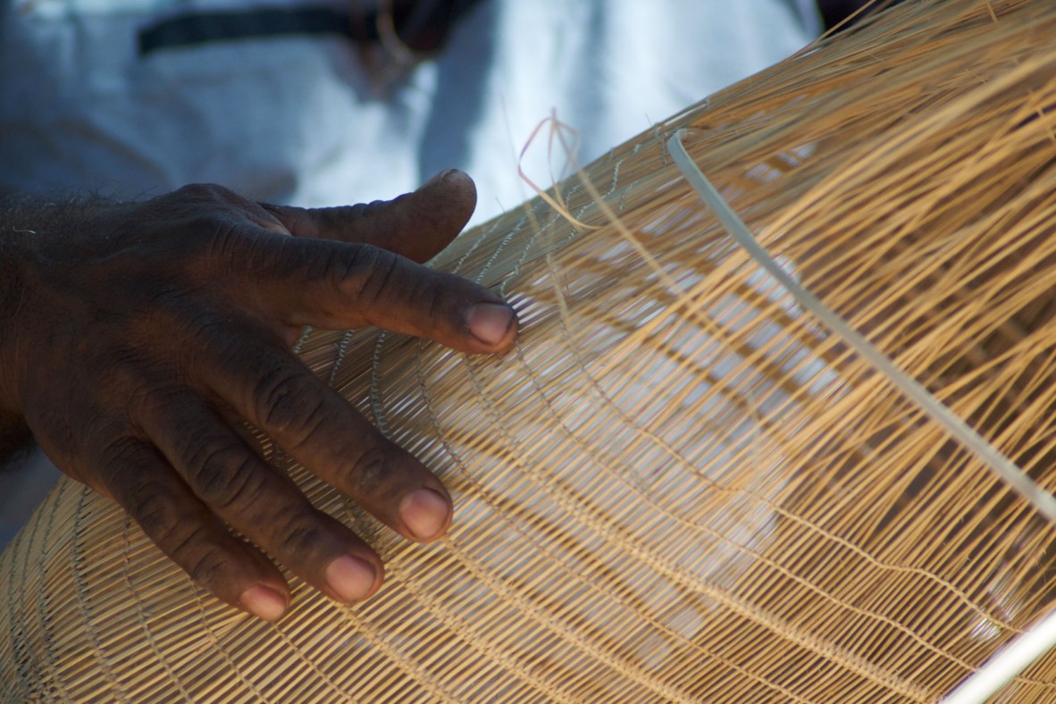 Abe Muriata weaving at the Laura Aboriginal Dance Festival, 2009.