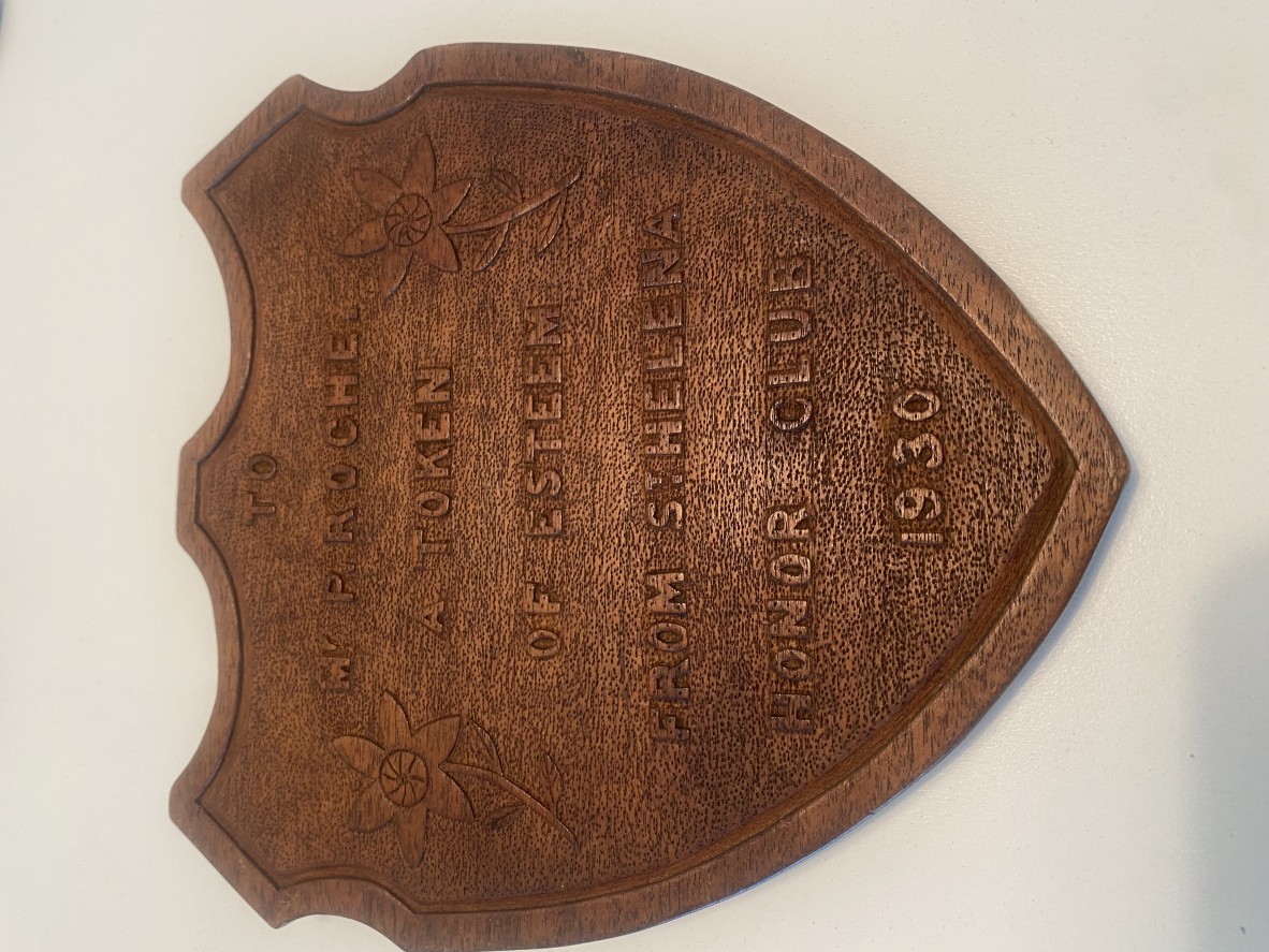 Wooden plaque with text “To Mr. Roche A Token of esteem from St Helena Honour Club 1930.