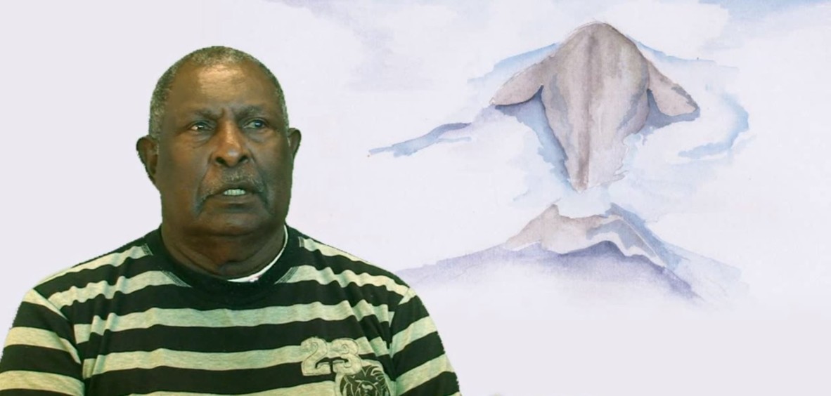 Storyteller Elimo Tapim with animated dugong.