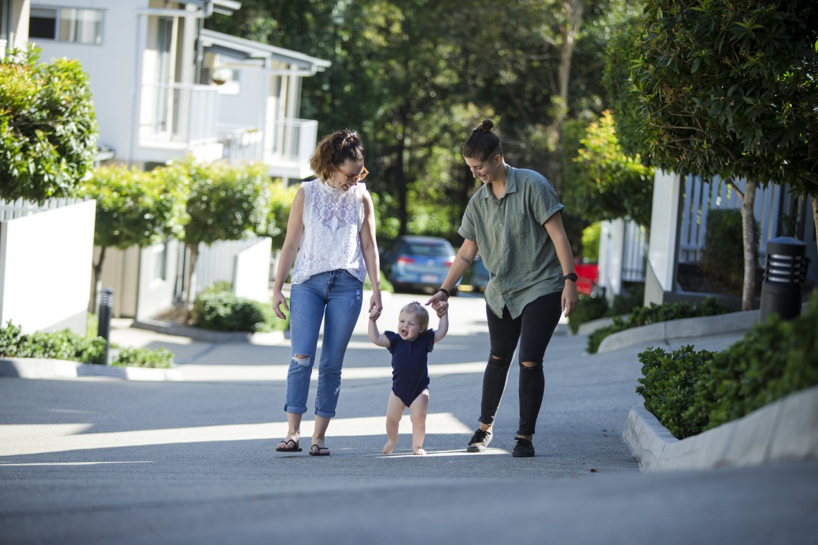 Parents walking outside with their baby