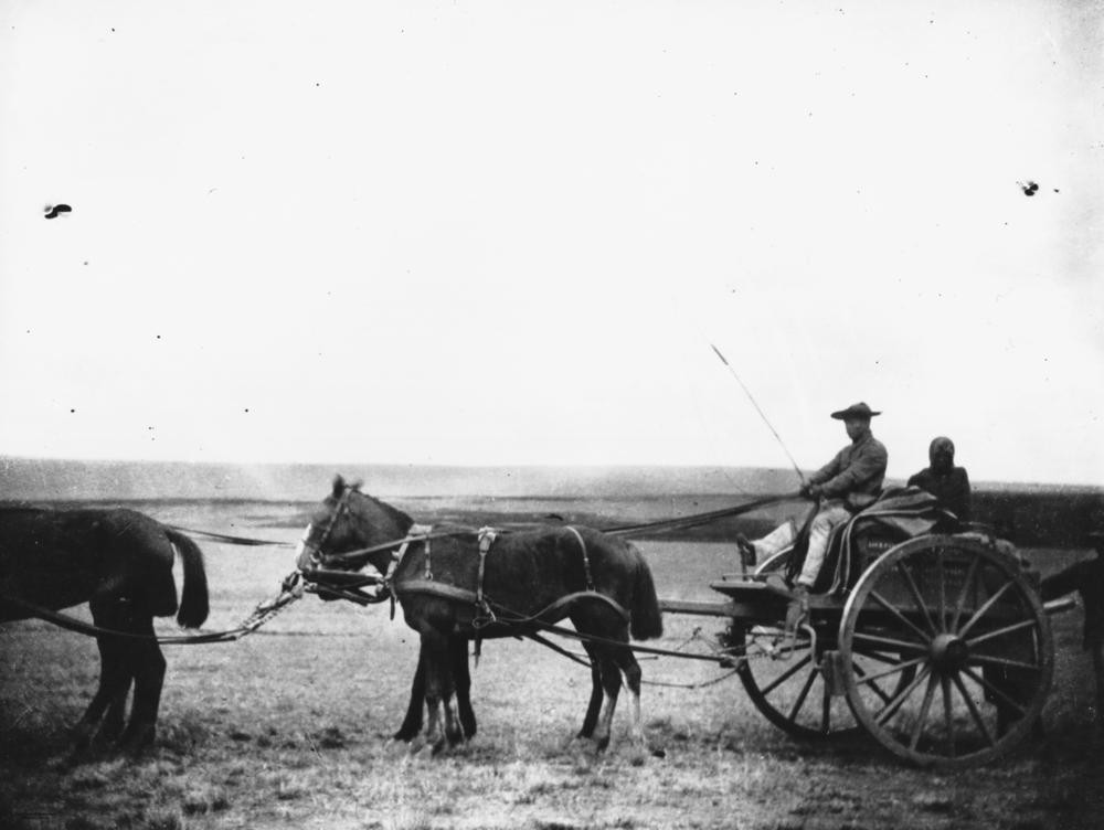 Chinese merchants on a horse-car.