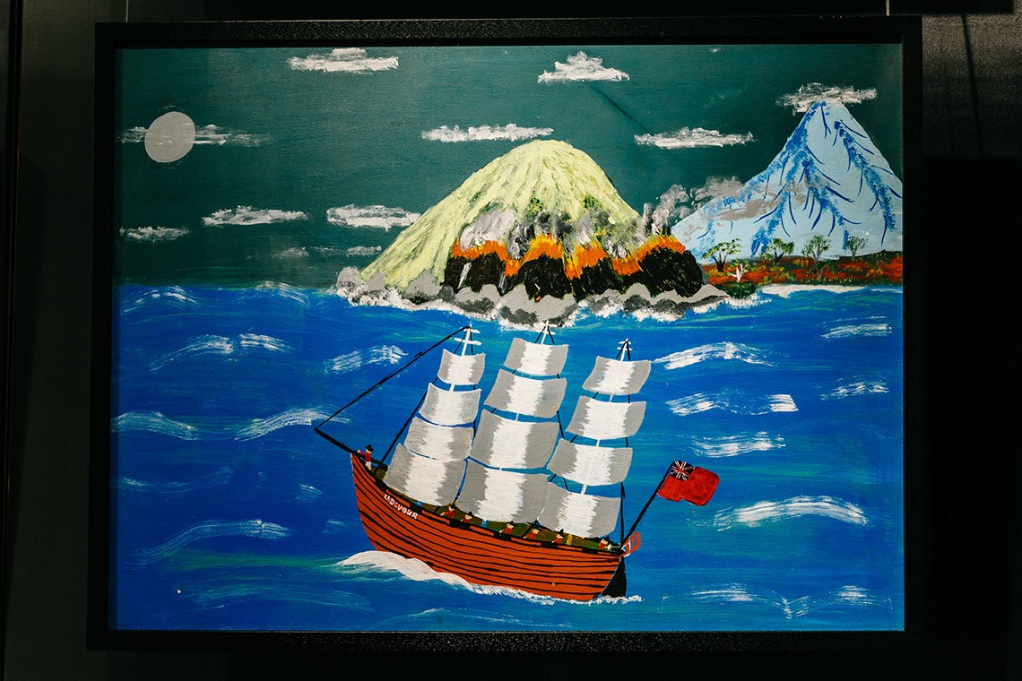 The painting Sail Away depicts the First Nations oral history of Captain Cooks landing at Endeavour River  The acrylic on plywood painting shows the night sky in the background with the mountains and land on fire  In the foreground is the ship Endeavour flying the English flag and sailing away 