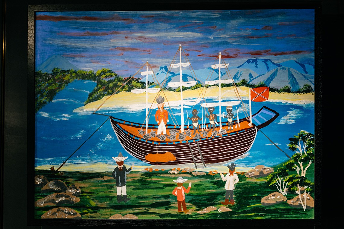 The painting entitled Twelve Turtles depicts the First Nations oral history of Captain Cooks landing at Endeavour River  The painting is acrylic on plywood and depicts Cooks ship in the Endeavour River with the twelve turtles Captain Cook and three Bama people onboard carrying spears  Some of Cooks men are watching from the shore