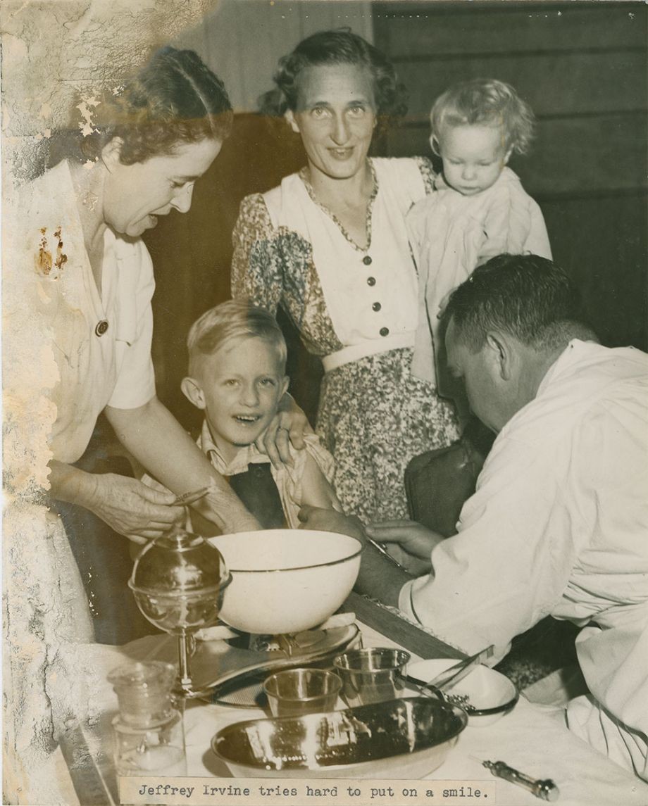 Medical Immunisation April 1949, Wendy Melloy faces up bravely while the next in line is curious, This youngster looks sceptical as the doctor from the health department injects Diphtheria serum into his arm, 1949, Brisbane Telegraph, Photographer unknown, John Oxley Library, SLQ, Negative no. 205265