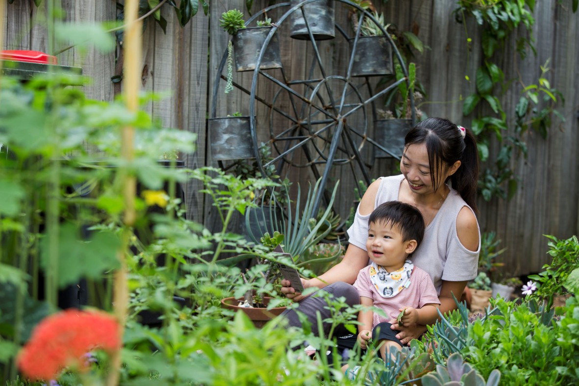 Mother and toddler in garden