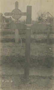 One wooden cross infront, two wooden crosses behind, military cemetery, ca.1917