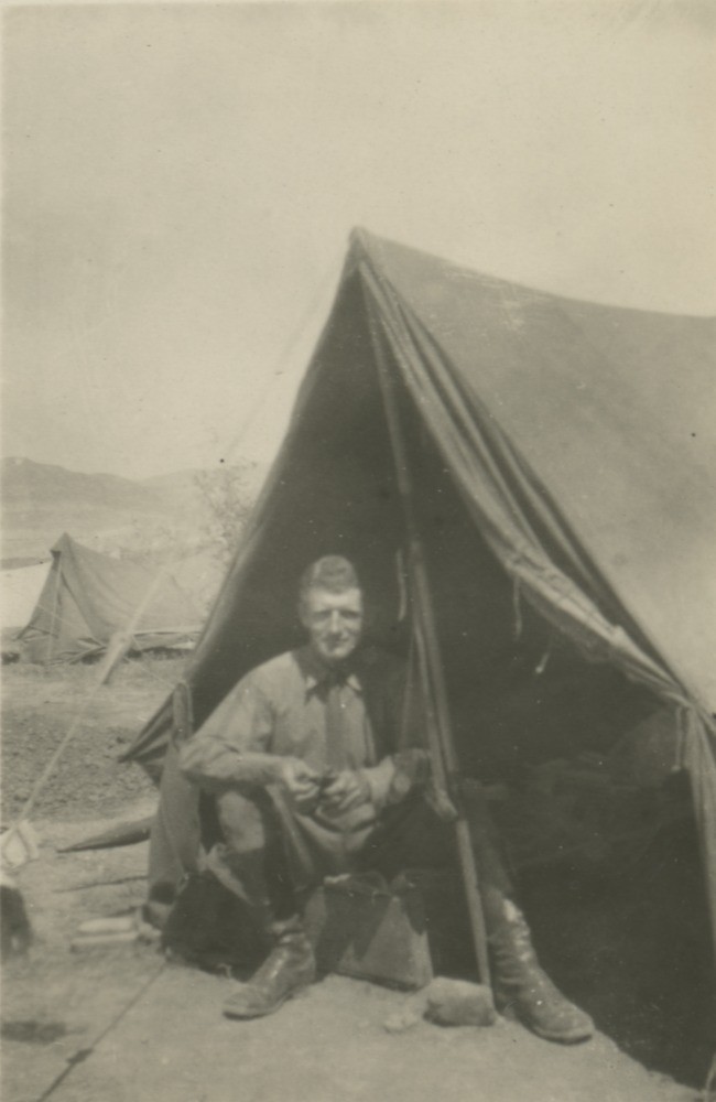 Man sitting at front of army tent in Middle East 1914-1918