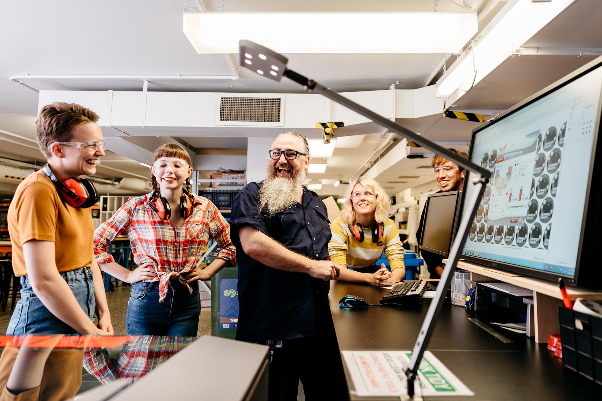Fab Lab People learning how to use the laser cutter in the Edge