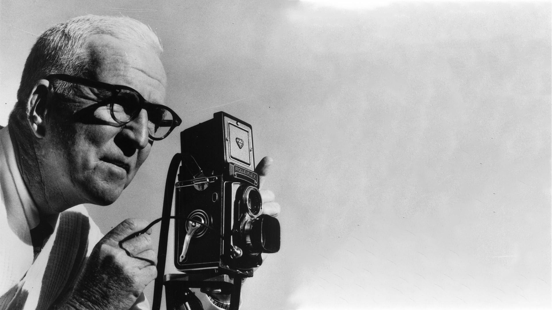 William Sneyd pictured with his Roliflex camera