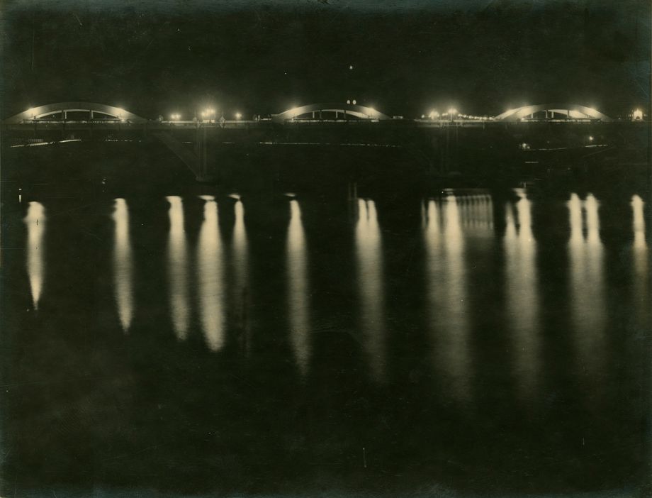 This photo was printed in the Brisbane Courier (31/3/1932 issue) and shows the moments after the lights were turned on for the first time on the Grey Street Bridge at the opening event. Lady Mayoress Greene turned on the switch and was given a memento of the switch, mounted on rosewood, as well as an engraved clock, by Manuel Hornibrook and Harding Frew.